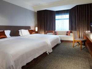 Letto o letti in una camera di Silks Place Yilan