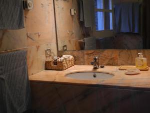 a bathroom counter with a sink and a mirror at Tranquilos estudios cerca de la playa in Cadaqués +22 photos