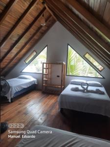 Postel nebo postele na pokoji v ubytování Chalet del Pacífico + 13 fotografií