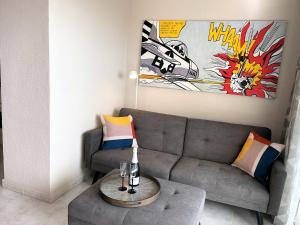 a living room with a couch and a table at MEERBLICK BEACH-APARTMENT Monte Rojo in San Agustin