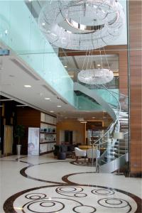 a lobby with a spiral staircase in a building at Tuyap Palas in Istanbul