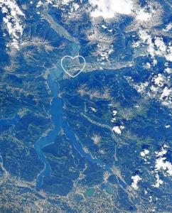 an aerial view of a river with a heart on it at La casetta di Biancaneve Valtellina e lago di Como in Dubino