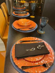 a table with plates of food on top at Flat Moderno e decorado Lapa-RJ in Rio de Janeiro +11 photos