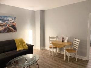 a living room with a couch and a table at Modern cozy 1BD/1BA Apt in Federal Hill in Baltimore