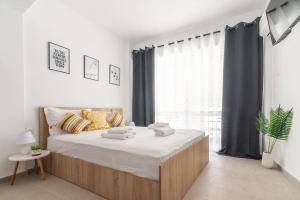 Posteľ alebo postele v izbe v ubytovaní New Studio in the Heart of City Center