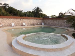 a large swimming pool in a resort at Villa Jardines de la Monarca in Rivera