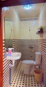 a bathroom with a sink and a toilet at Peace Hotel in Marrakesh