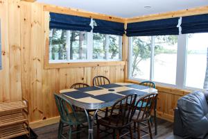 a dining room with a table and chairs at Lake Winnisquam Getaway in Sanbornton