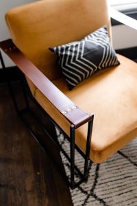 a bench with a pillow sitting on top of it at Cozy & Stylish Home in Downtown Atlanta in Atlanta