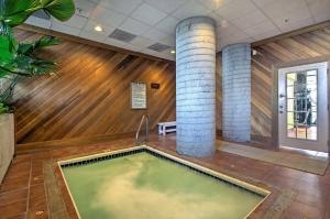 a pool in the middle of a room with wood at Altitude Adjustment atop Sugar Mountain at Sugar Top in Sugar Mountain