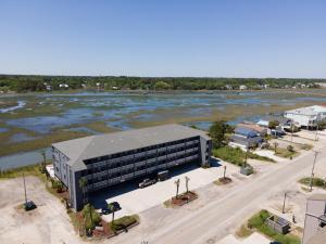 an aerial view of a building next to a river at Bella Vista: Marshfront Condo 1 Block To The Beach. Pool & Hot Tub-1st Floor in Murrells Inlet