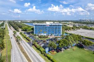 an aerial view of a hotel with a parking lot at Stadium Hotel in Miami Gardens