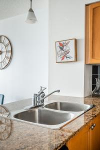 a kitchen counter with a sink in a kitchen at GLOBALSTAY 1 Bedroom & Den Condo in the Heart of Downtown Toronto in Toronto
