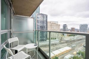a balcony with a view of a city at GLOBALSTAY 1 Bedroom & Den Condo in the Heart of Downtown Toronto in Toronto