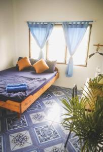 A bed or beds in a room at Lungkluay homestay