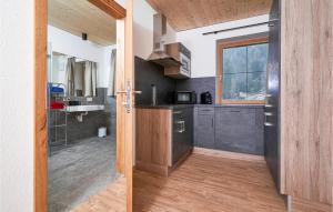 an open door to a kitchen in a house at Moderne Ferienwohnung in Längenfeld