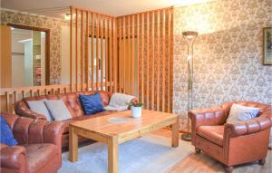 a living room with a couch and two chairs and a table at Awesome Home In Asarum With Wifi in Asarum