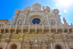 a building with a clock on top of it at Casa vacanze Puccini in Lecce
