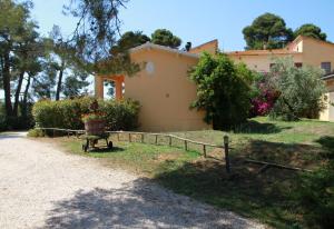 a house with a fence in front of it at Agriturismo La Ronca in San Vincenzo
