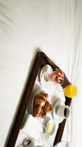 a picture of a shelf with plates and dishes at Sea Nest in Alibaug