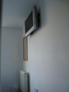 A television and/or entertainment centre at Hostel Alma