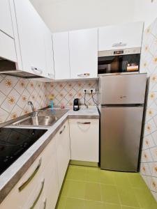A kitchen or kitchenette at Nulauro Home
