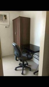 a office with a chair and a desk and a cabinet at Eagle's Nest - Furnished 1BR Condo w/ WIFI in Manila