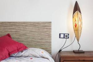 A bed or beds in a room at La Rosada 9