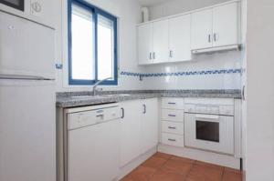 A kitchen or kitchenette at La Rosada 9