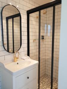 a bathroom with a sink and a shower at Dangerfield Oaks Boutique Cottage's in Mudgee