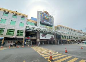 a large building with orange cones in front of it at CN Homestay A1 Floor 1 at Nagoya Hill Mall in Jodoh