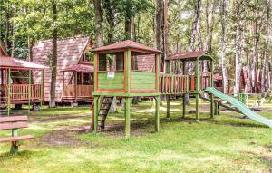 a group of playground equipment in a park at Gorgeous Apartment In Lukecin With Kitchen in Łukęcin