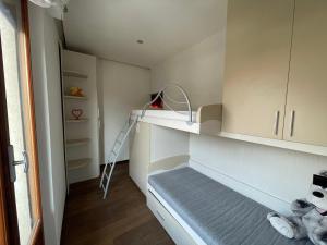 a small room with a ladder and a shelf at Residenza MaryLou in Porto SantʼElpidio