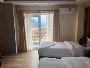 Katil atau katil-katil dalam bilik di Hotel Murano