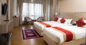 Letto o letti in una camera di Landmark Kathmandu