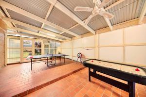 a large room with two ping pong tables in it at Charming 3BR Family Home In A Perfect Location in Narre Warren