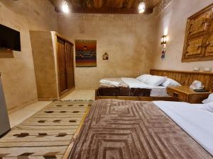 Rúm í herbergi á Qasr El salam