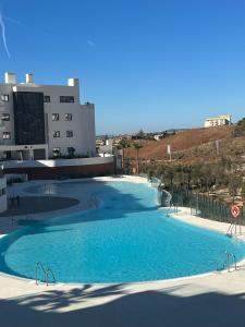 The swimming pool at or close to New apartment in Higueron West