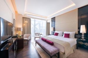 Кровать или кровати в номере Shaza Doha