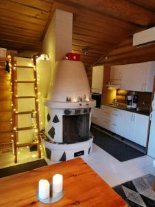 a kitchen with a large oven in the middle of it at Heteranta, Lake Inari / Inarijärvi in Inari