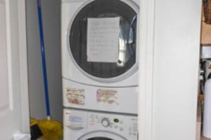 a washer and dryer in a kitchen at Waterfront Delight at Spindle Point in Meredith