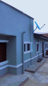 a blue building with pipes on the side of it at 8 bedroom holiday home with great ambiance in Ofatedo