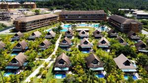 an aerial view of a resort with a pool at Eco Resort Praia dos Carneiros - Flats & Bangalô - LocarHouse in Tamandaré