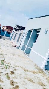 a row of houses sitting next to a beach at 8 bedroom holiday home with great ambiance in Ofatedo