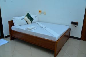 Postel nebo postele na pokoji v ubytování Flamingo Hotel Kinyerezi