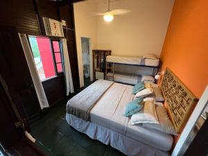 Cama ou camas em um quarto em Pousada Paloma