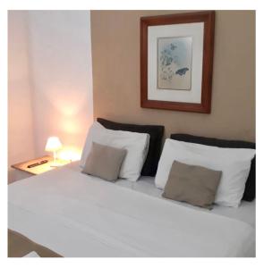 Ένα ή περισσότερα κρεβάτια σε δωμάτιο στο Pousada Mainá