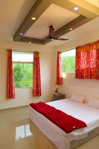 Postel nebo postele na pokoji v ubytování SPICE GREEN RESIDENCY