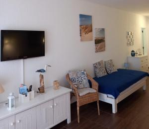 TV a/nebo společenská místnost v ubytování Casa da Carmen - Estúdio em Albufeira