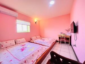 Letto o letti in una camera di Xingang Homestay